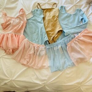 4 little leotards and three shimmer skirts size from 5-7
